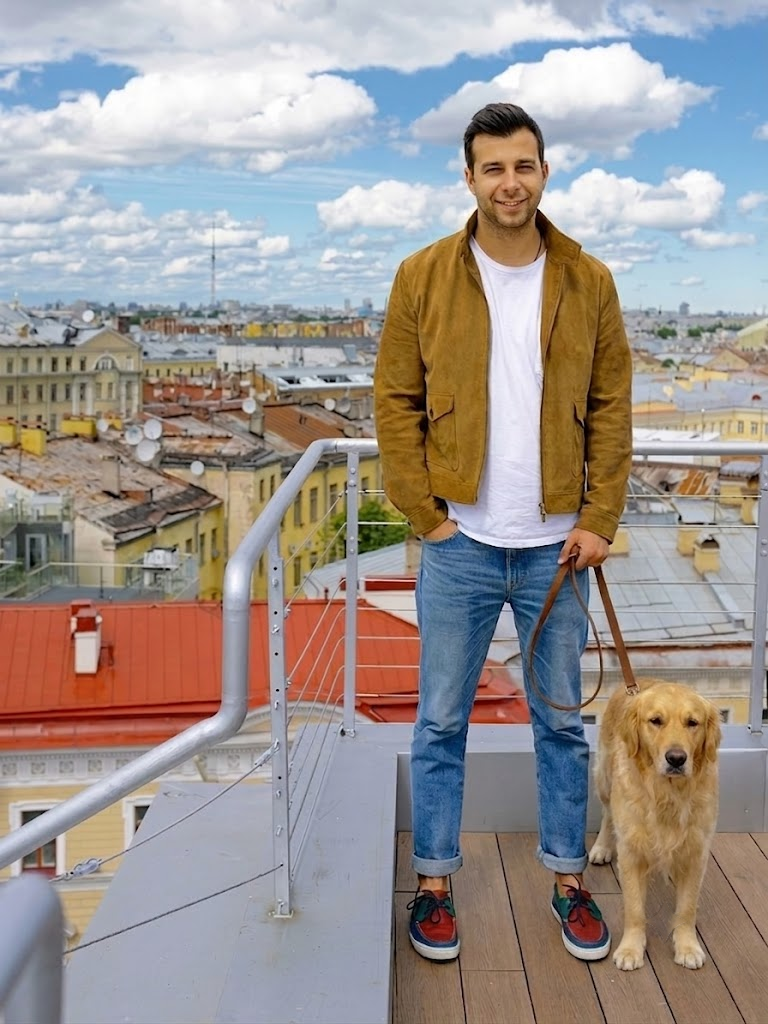 Vlad Tenev with Toby, his rescue dog, in a studio portrait